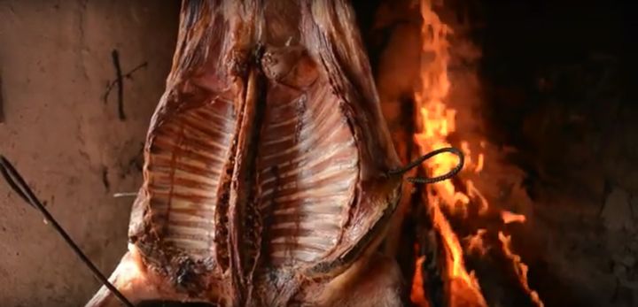 Patagonian lamb on the cross by the fire.